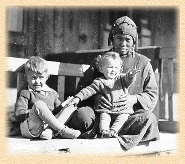 Photo taken by Carlson's father of Carlson (left), his sister Carol Jean, and their Tibetan helper Dromatso.  Accession 93-34.