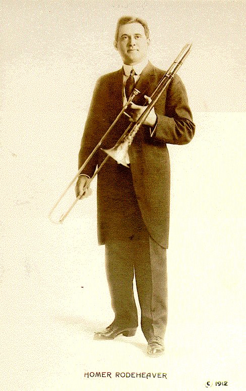 Posed shot of Rodeheaver with his trombone, 1912.  From Photo File:  RODEHEAVER, HOMER