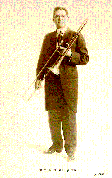 Posed shot of Rodeheaver with his trombone, 1912.  From Photo File:  RODEHEAVER, HOMER